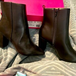 Brand new, never worn black heeled boots